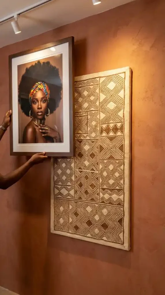 Large-Afro-Queen-portrait-being-evaluated-beside-Kuba-cloth-anchor