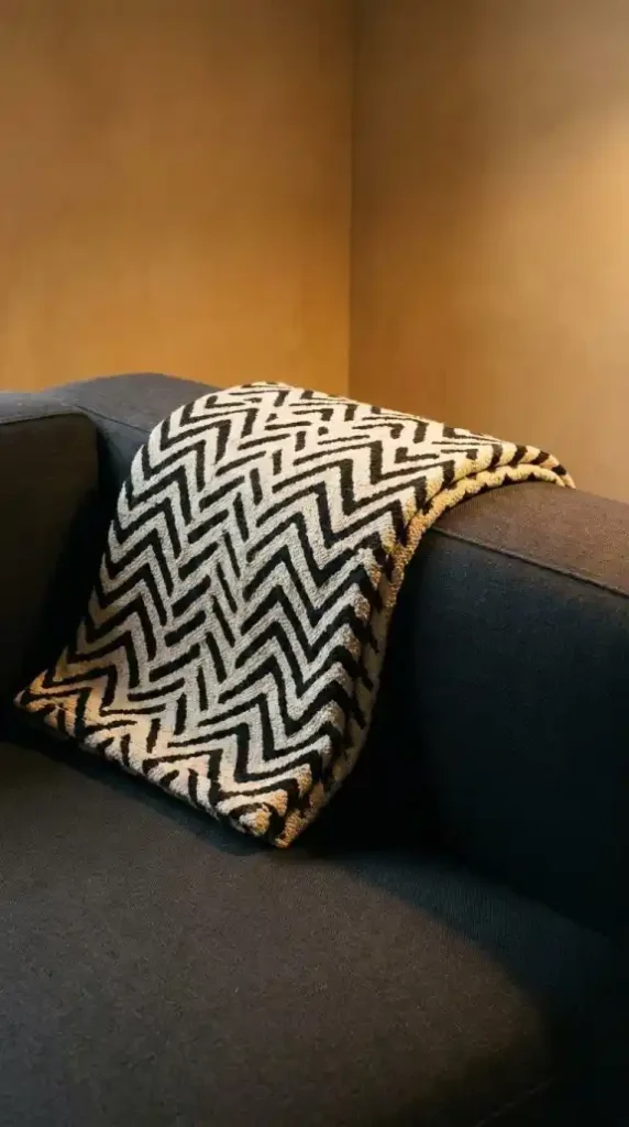 editorial-close-up-of-a-mud-cloth-throw-in-black-and-cream-geometric-chevron-pattern