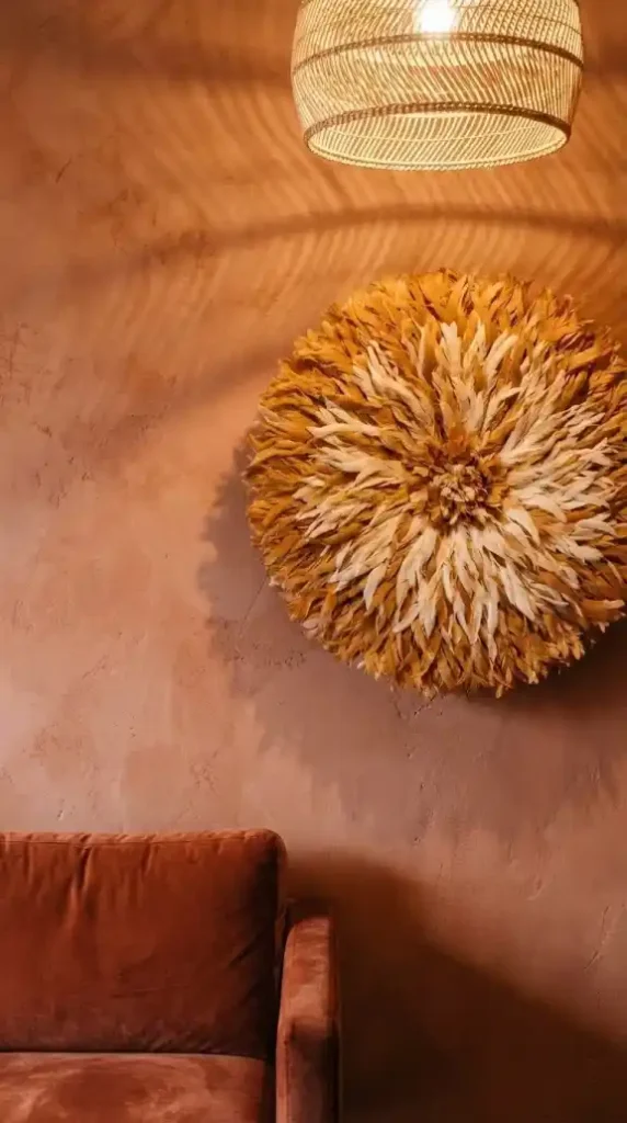 Large-ochre-cream-Juju-hat-on-warm-terracotta-plaster-wall